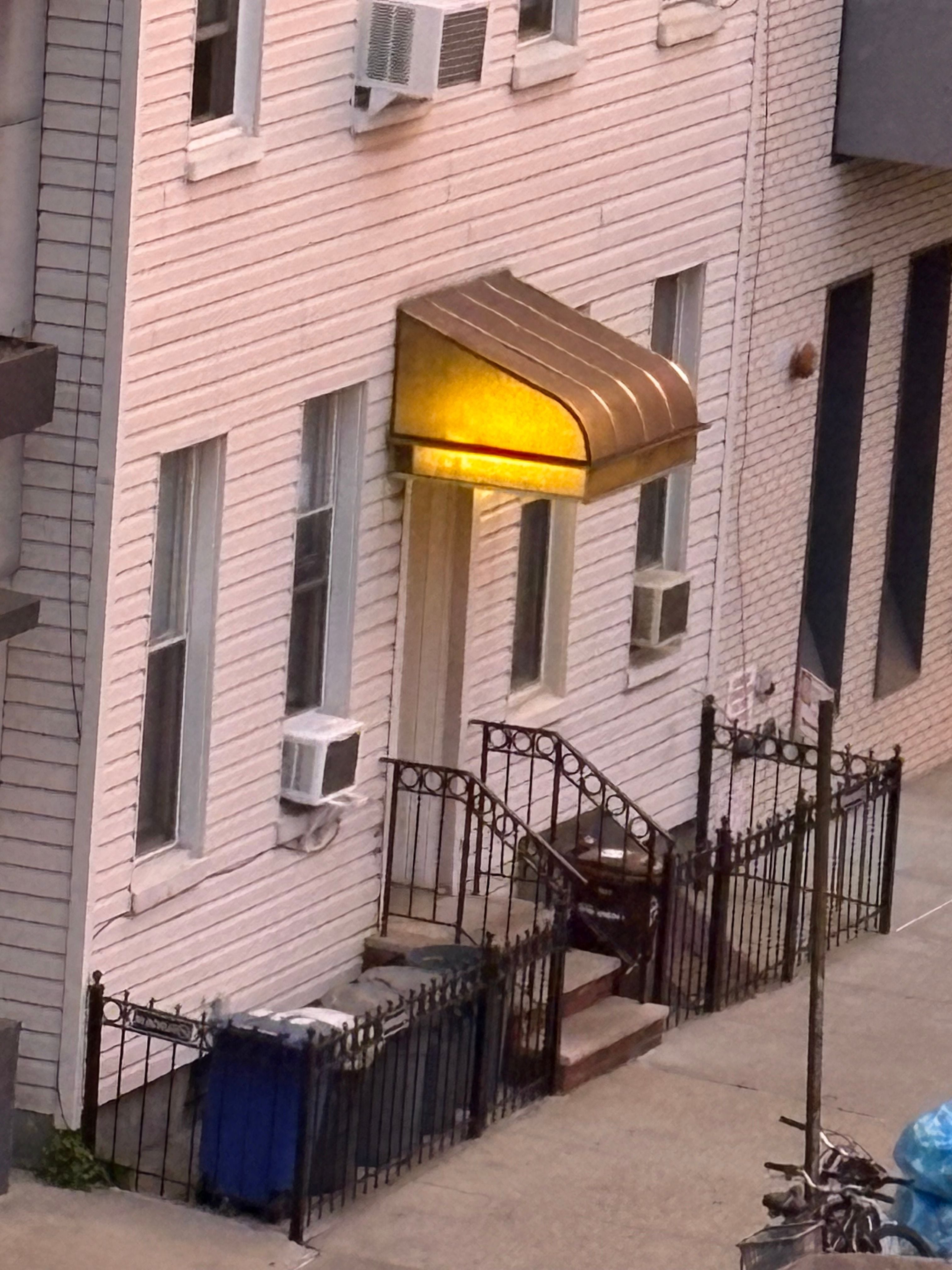 Photograph of an illuminated residential awning in Brooklyn