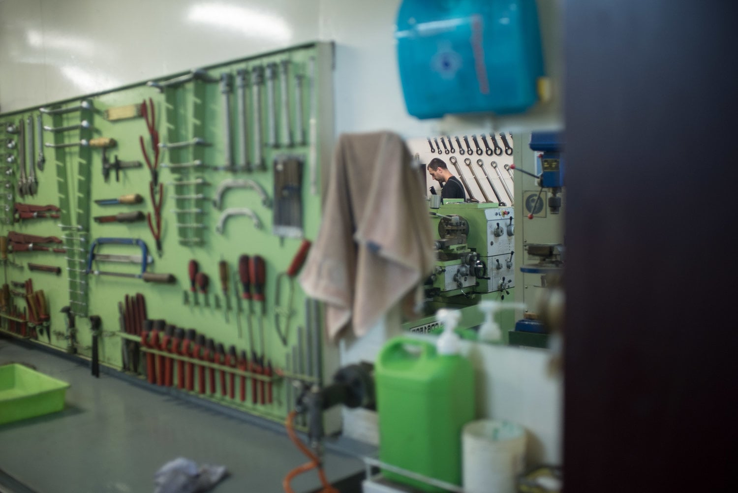 Person in a mirror in the machine room