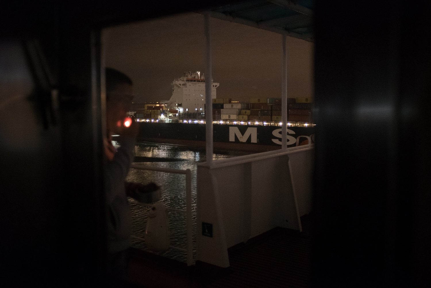 Person smoking a cigarette on the ship